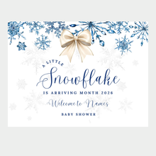 Winter baby shower banner with champagne bow and blue snowflakes that says A Little Snowflake is Arriving with personalized name and date