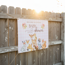 Woodland baby shower welcome banner with cute forest animals deer fox bunny deer and pink spring flowers that says Welcome to baby shower with personalized name and date
