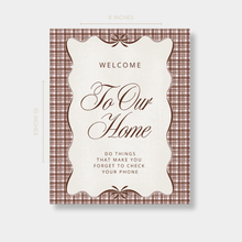 Welcome To Our Home sign with brown plaid and coquette bow accents for farmhouse entryway decor